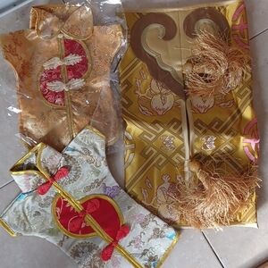 Three silk and satin covers for gift bottles